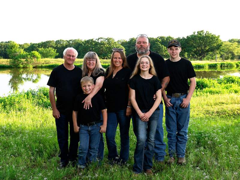 Family of seven by a pond at golden hour — McKinney family session by BK Bennett