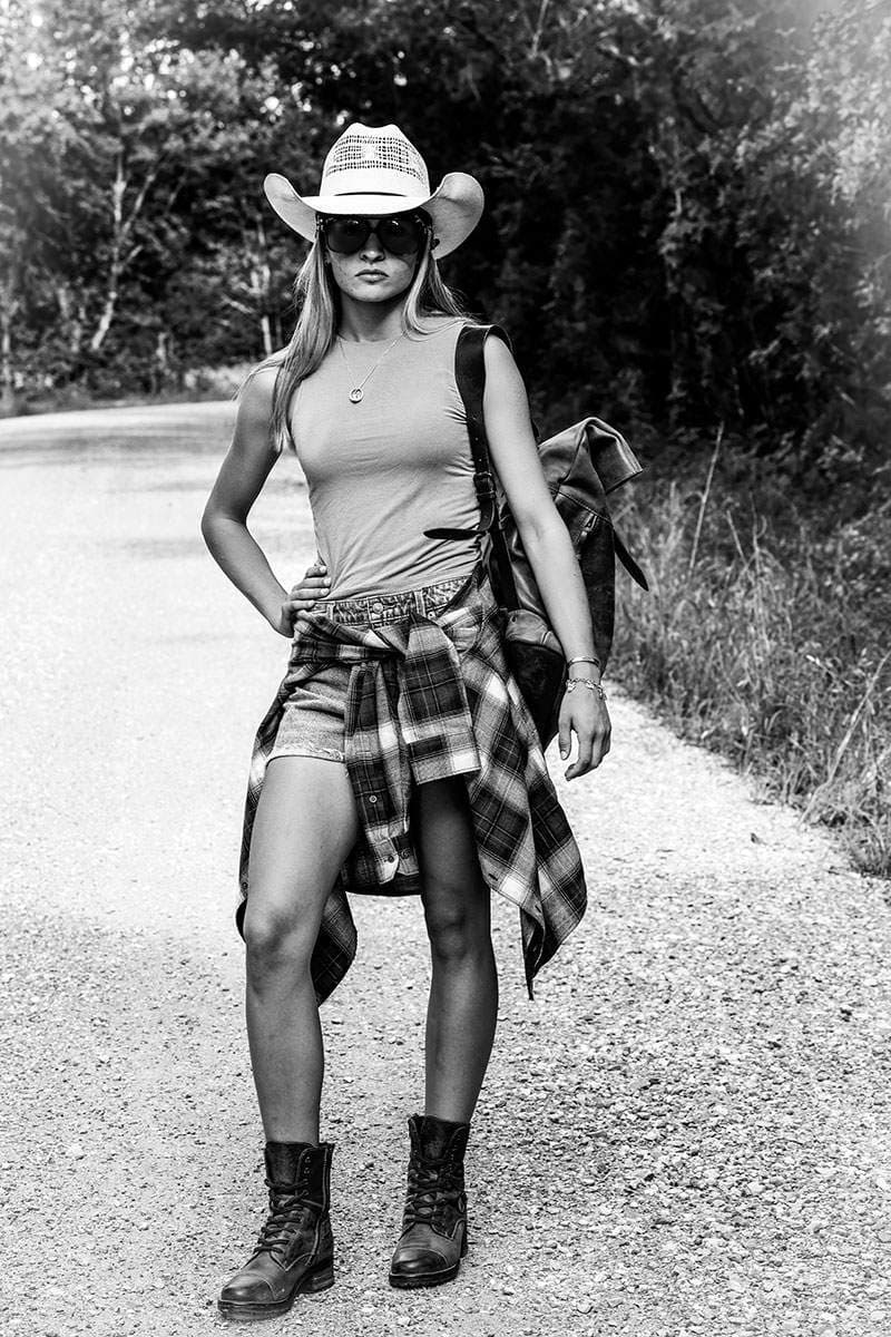 Black-and-white senior portrait on a country road — Fort Worth senior photographer BK Bennett